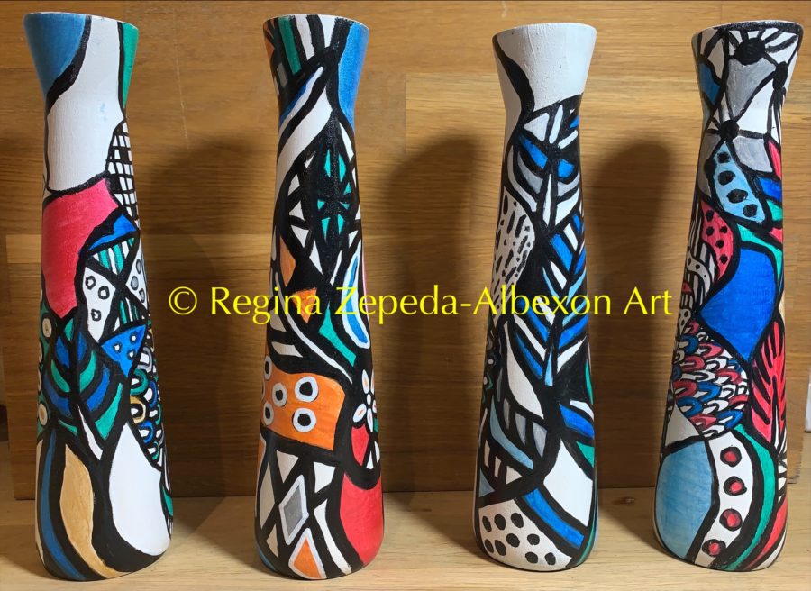 Candle Holders With a Zepeda-Albexon Art Design on Them